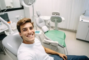 young man happy surprised expression dentist clinic